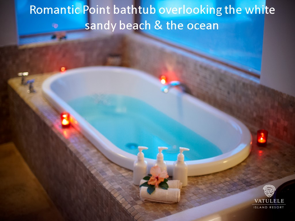 Romantic Point bathtub overlooking the white sandy beach & the ocean